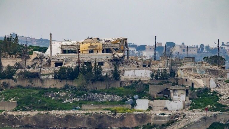 Satellite-style view of a heavily damaged urban area and ruined buildings